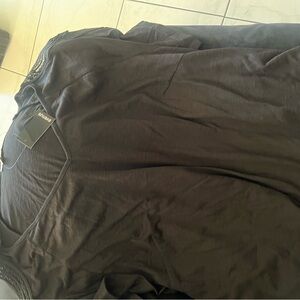 NWT black top with cool design on sleeves. A staple in all wardrobes.